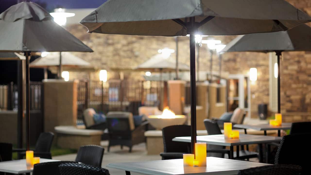 Hyatt House Raleigh Durham Airport Outdoor Patio Tables with Umbrellas in Raleigh NC