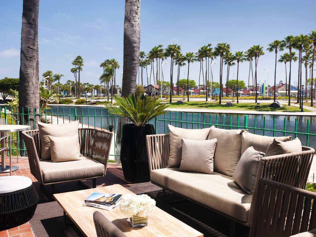 Palm Suite terrace with outdoor seating area and lagoon views