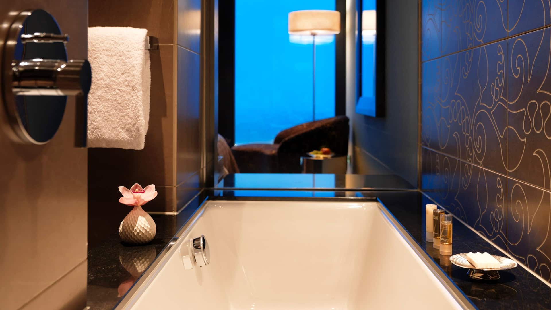 3 of 5 Standard King Room at Hyatt Regency Dusseldorf, with open bathroom, freestanding bathtub and view of the city of Dusseldorf
