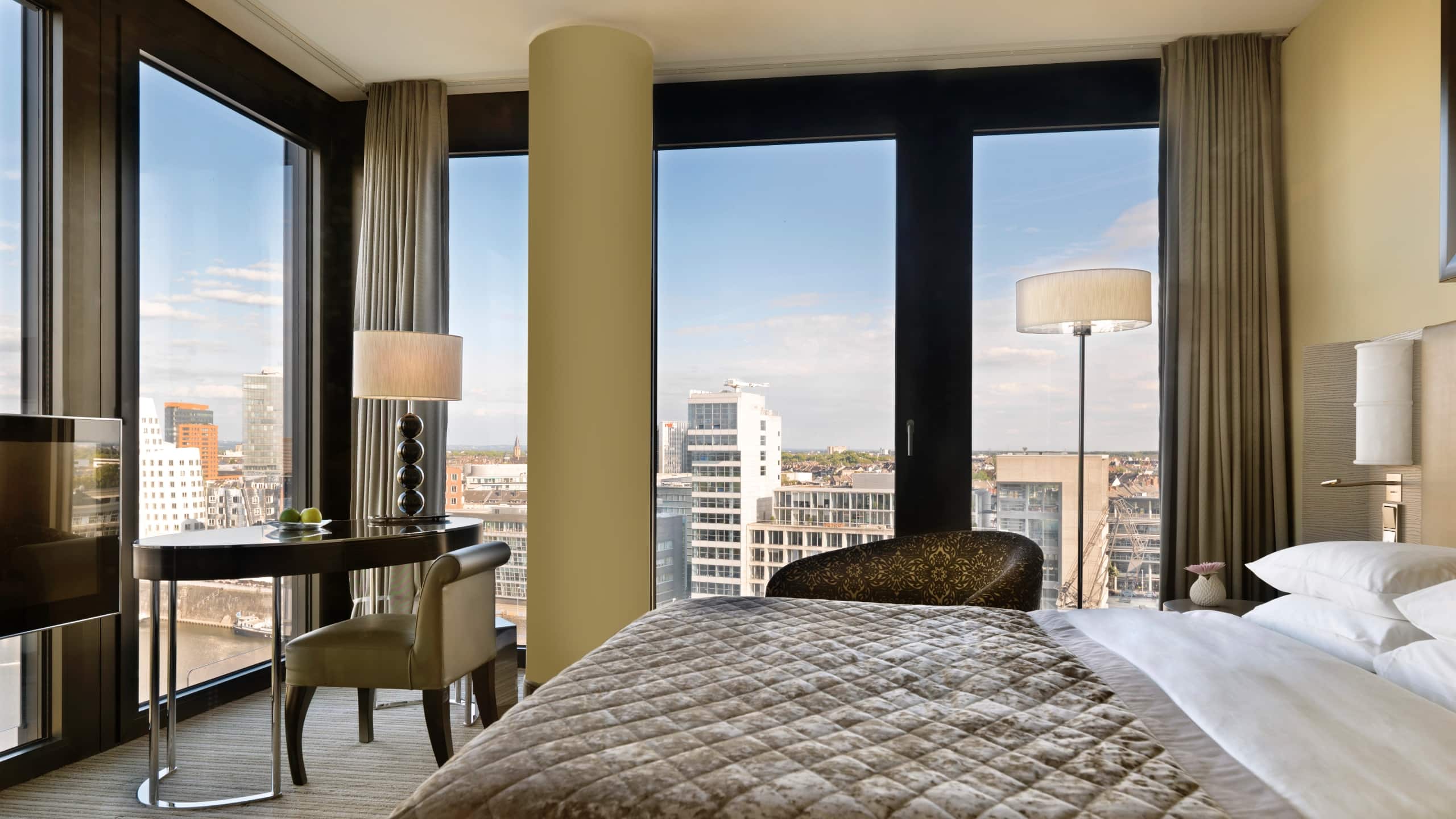 View King Room at Hyatt Regency Dusseldorf with a beautiful view of the skyline of the city of Dusseldorf and a desk for work