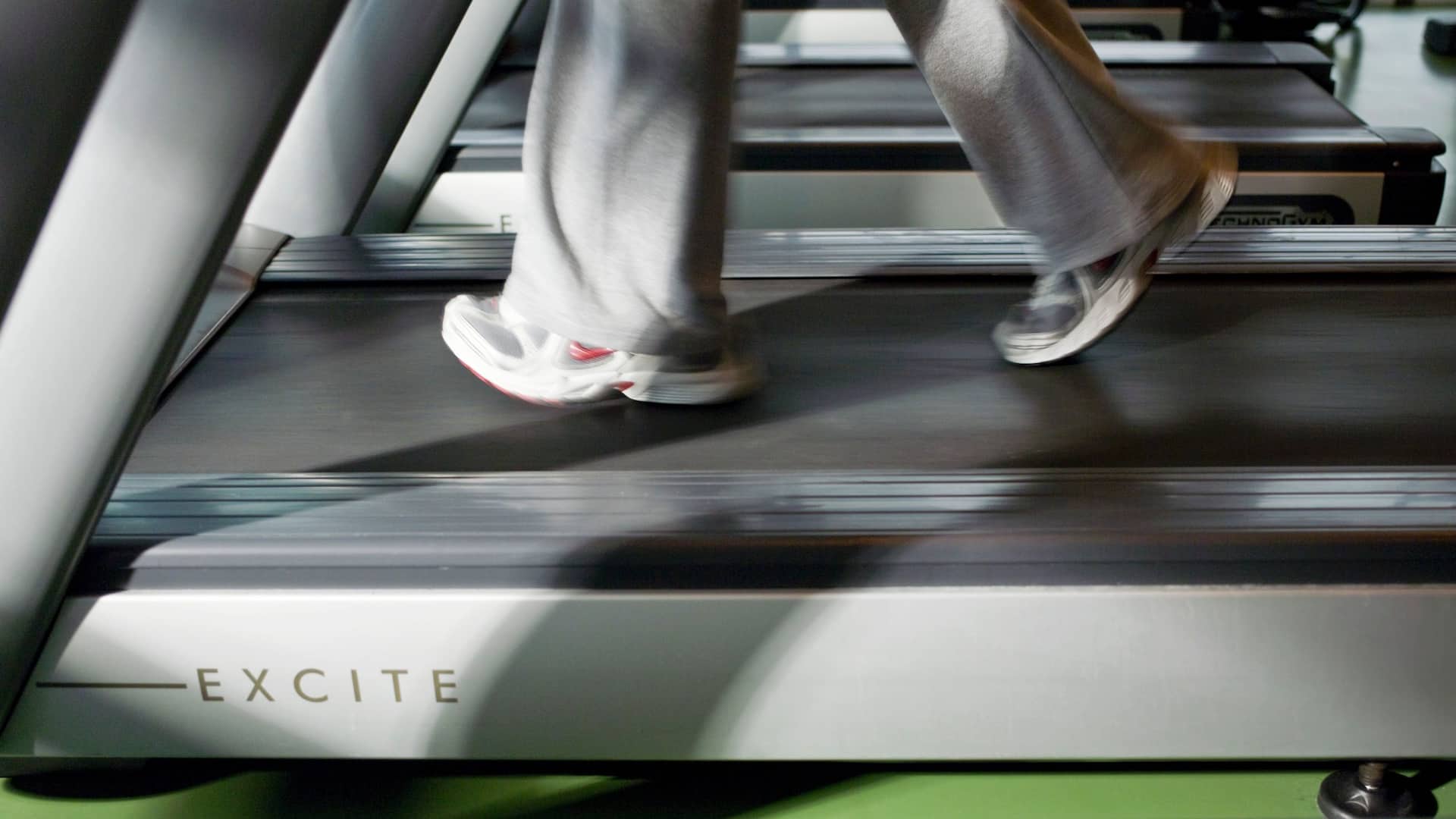 Treadmill close up of running feet at
