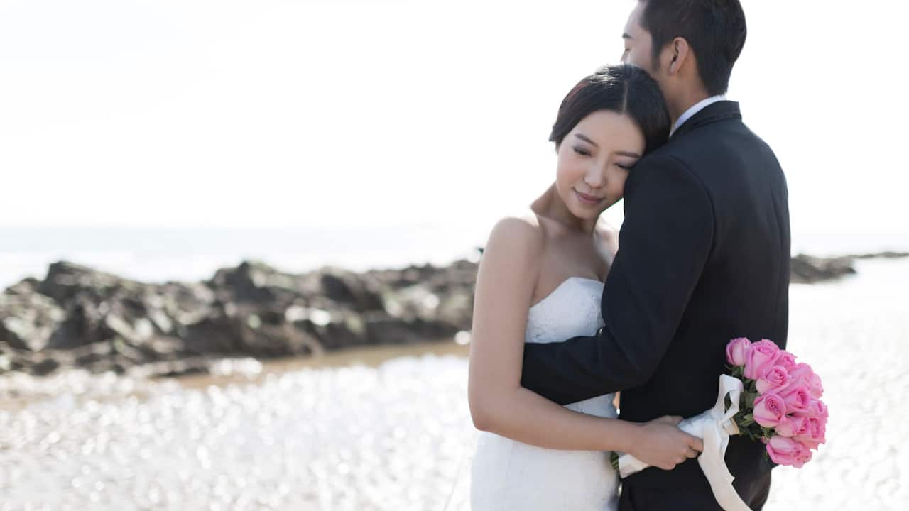 Wedding Couple by the Ocean