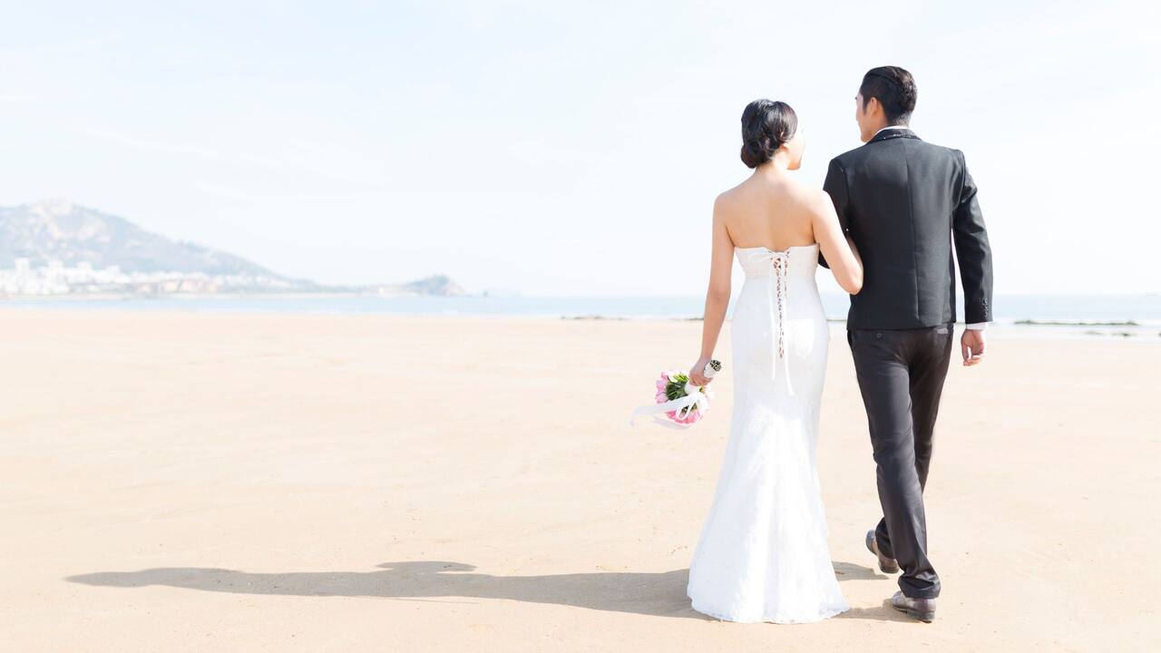 Wedding Couple Walk on the Beach