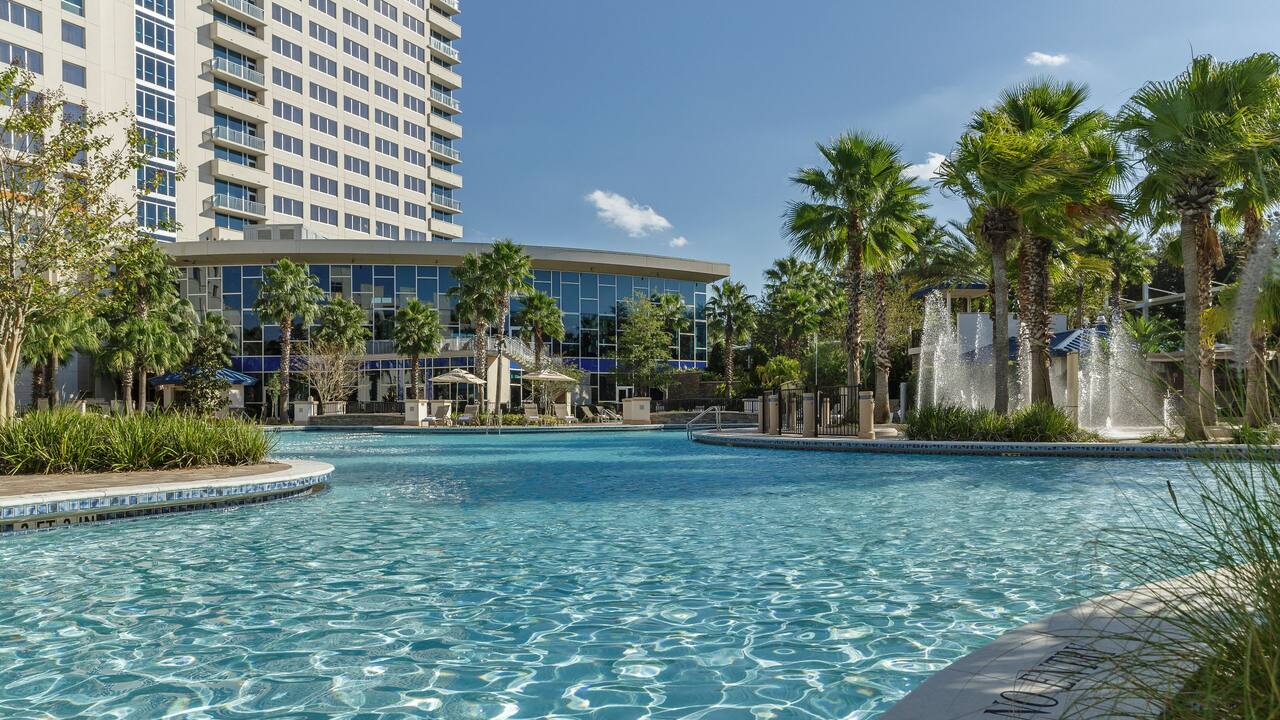 Hyatt Regency Orlando Outdoor Swimming Pool Surrounded by Palm Trees in Orlando Florida