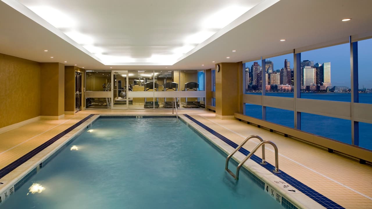 Indoor pool with a waterfront view of the Hudson River 