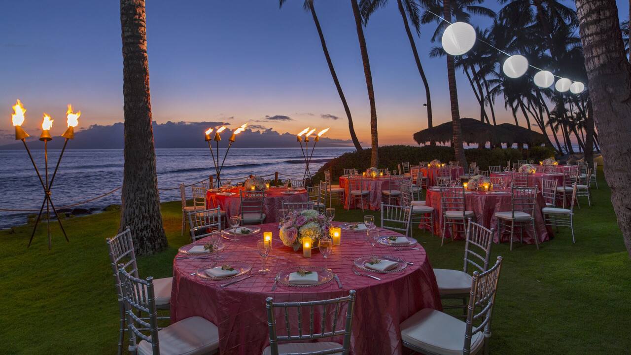 Napili Garden and Lawn evening wedding reception banquet tables