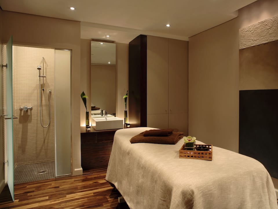Amala spa treatment room with massage bed