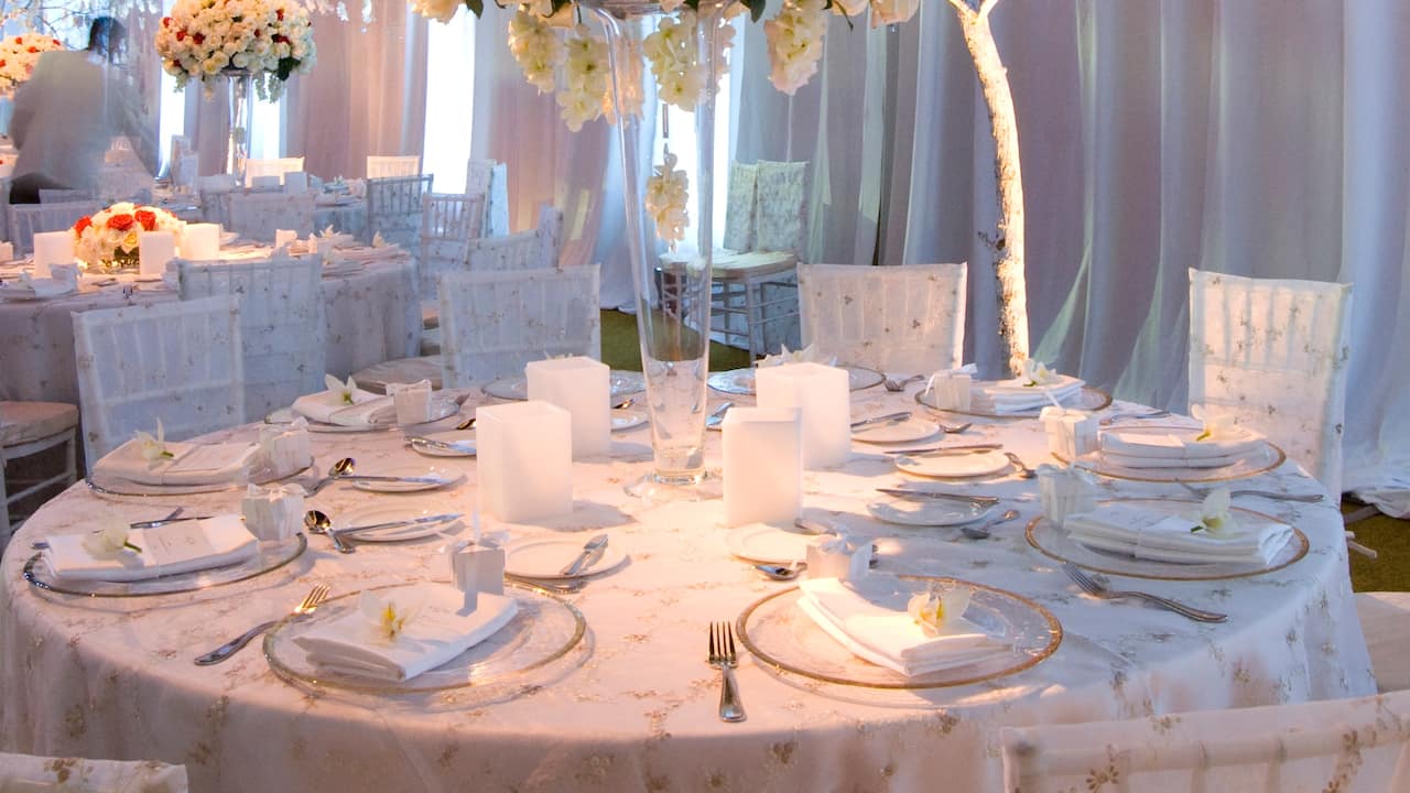 Close-up of Wedding reception table with dining set-up and decorations