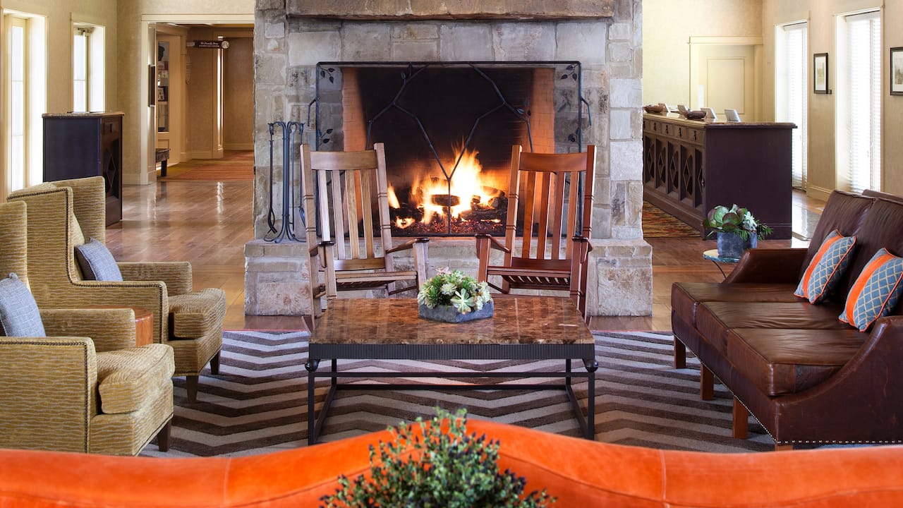 Lobby fireplace with sofas and rocking chairs