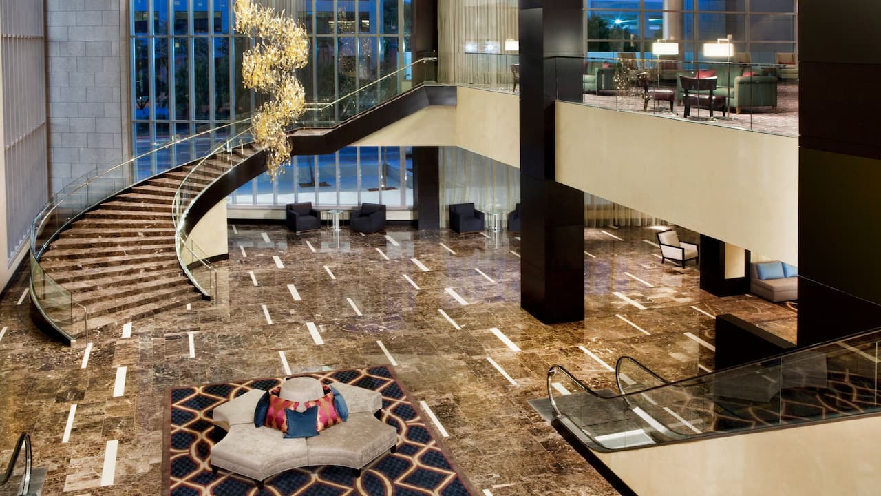 Lobby staircase with spacious seating at Hyatt Regency New Orleans