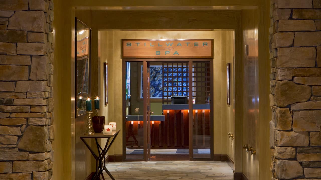 Stillwater Spa entrance with glass door and cozy ambiance