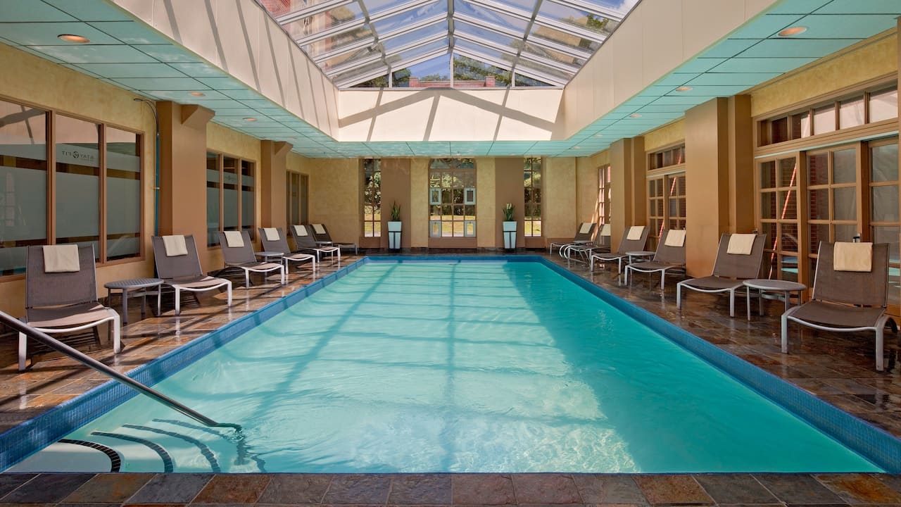Indoor pool with loungers at Hyatt Regency Greenwich