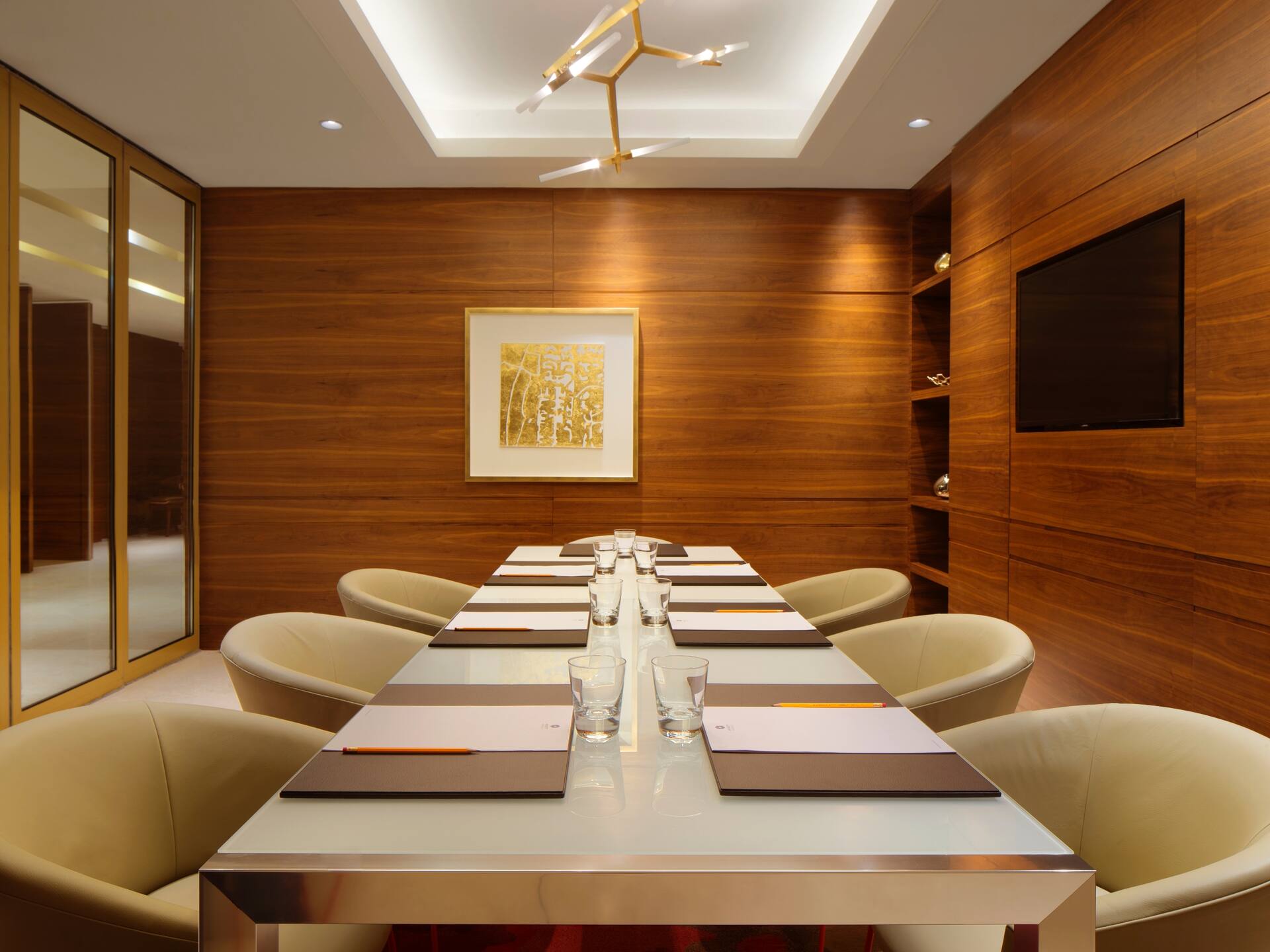 Chairs at large table in meeting room
