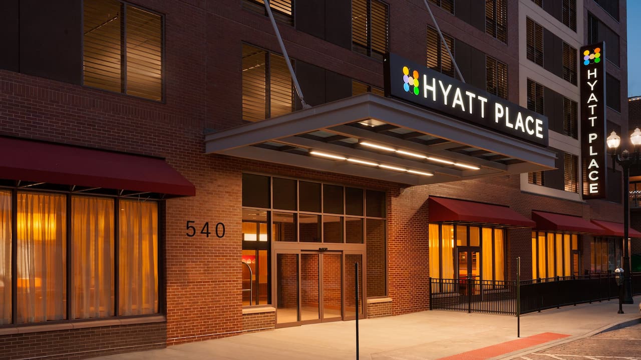 Exterior photo of hotel in Old Market Downtown Omaha at dusk at Hyatt Place Omaha / Downtown Old Market 
