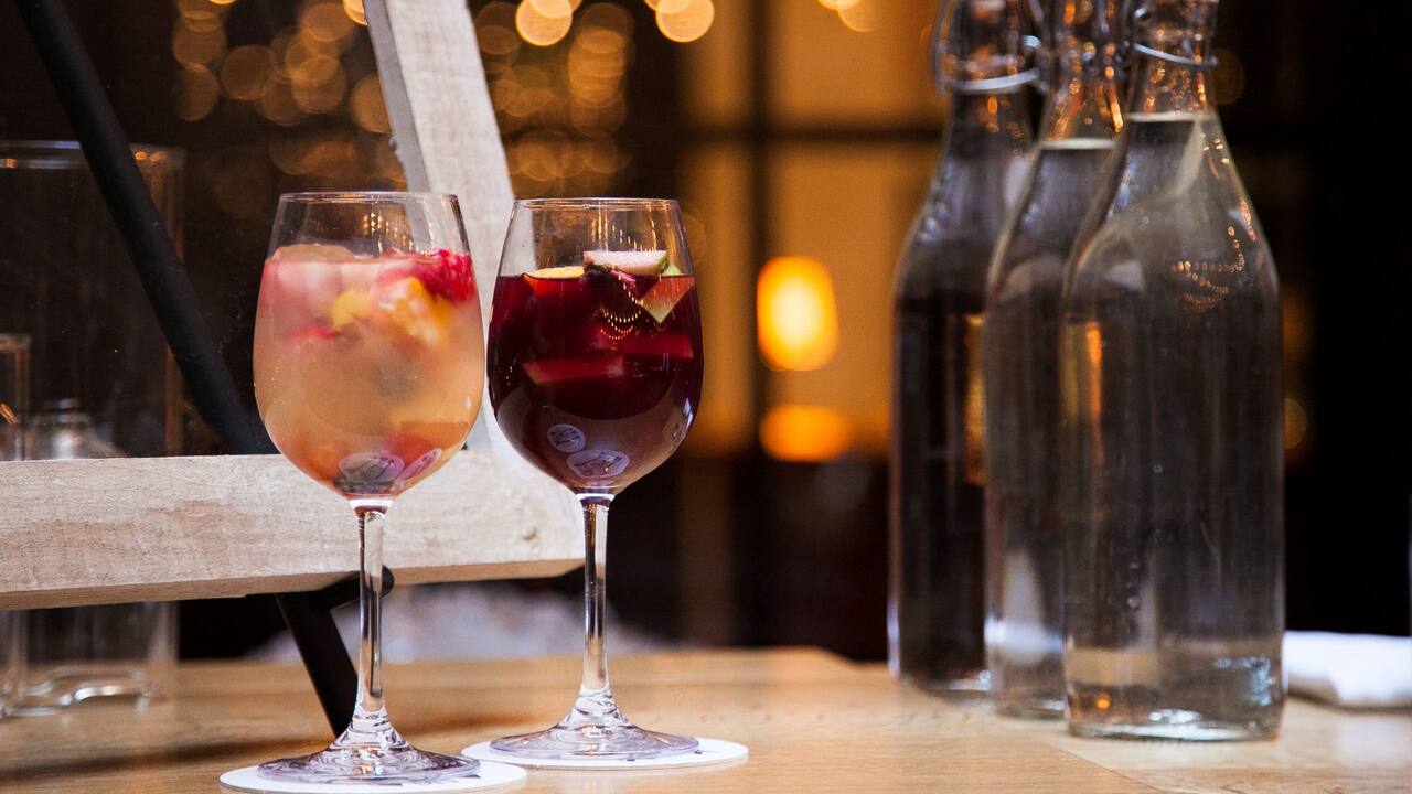 sangria on a table with water