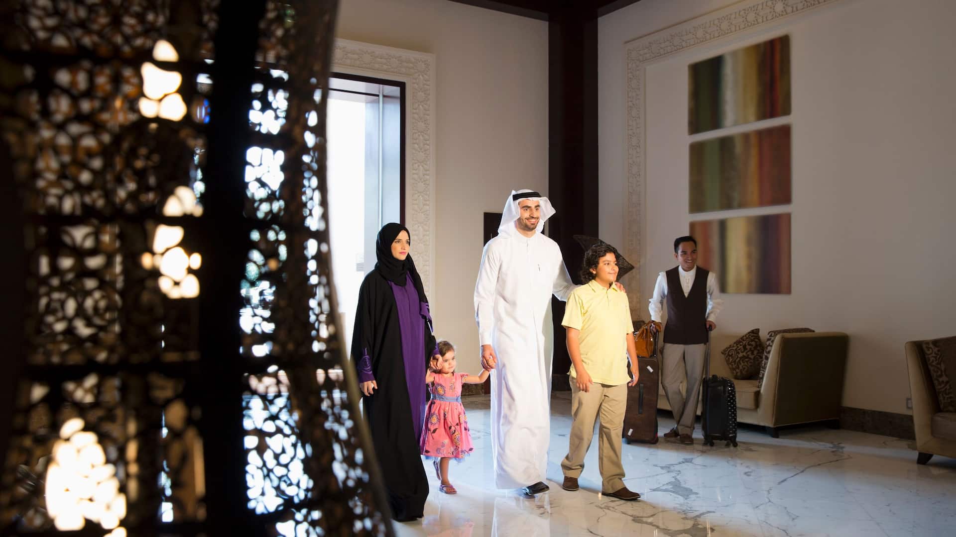 Global ME_P022 Family Walking in Lobby