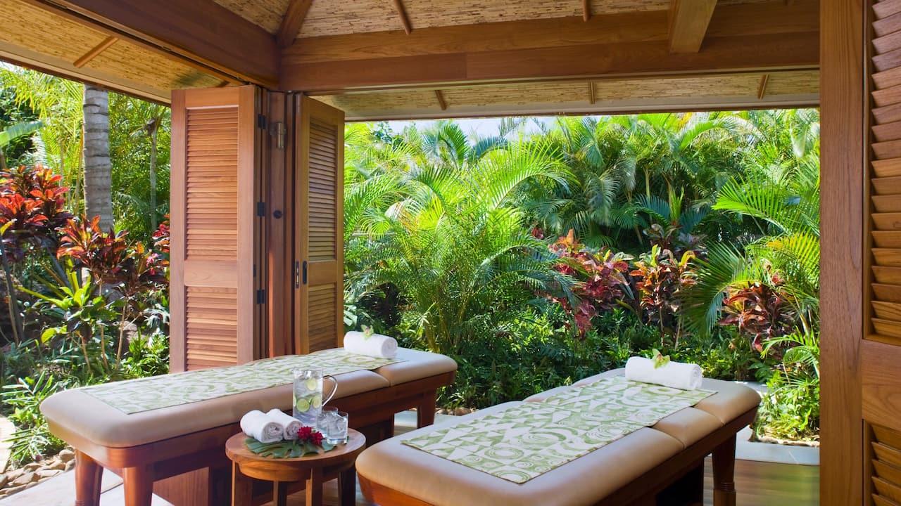Anara Spa couples massage room with two massage tables with outdoor views at Grand Hyatt Kauai Resort and Spa