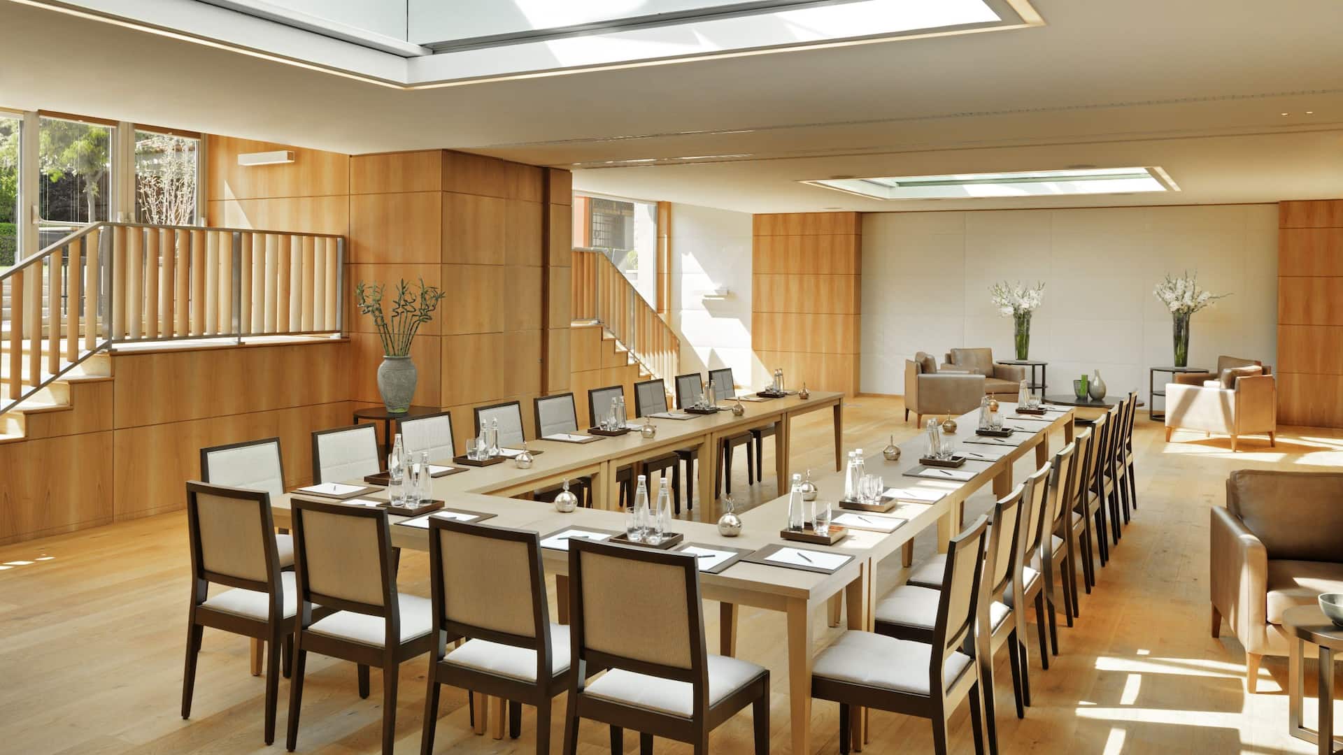 Two ladies at the open buffet in Grand Hyatt Istanbul's Grand Club, with a spacious comfortable seating and soft colors furnishings.