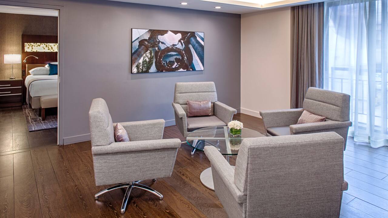 Congressional Suite living room with coffee table and chairs 