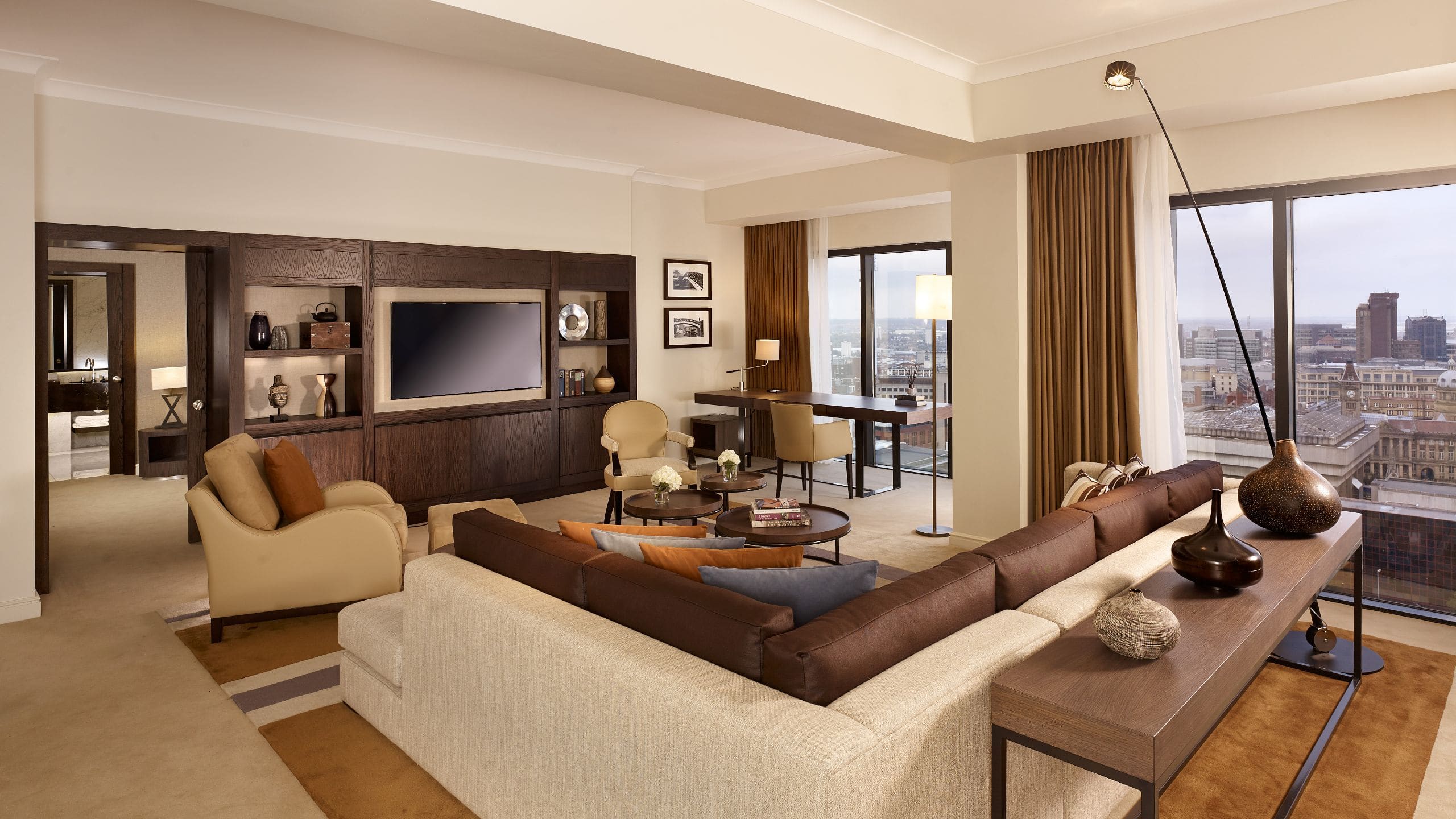 Suite with massive sofa, armchairs, coffee table and TV