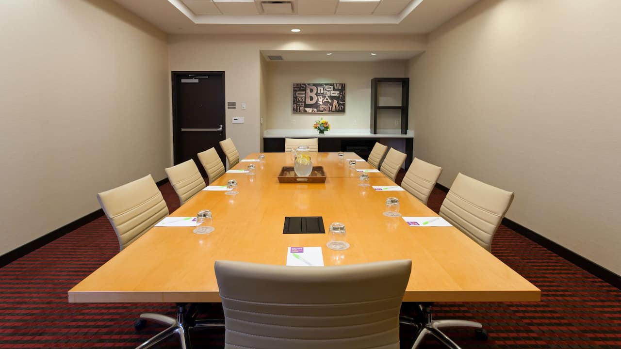 Meeting room with large conference table and chairs