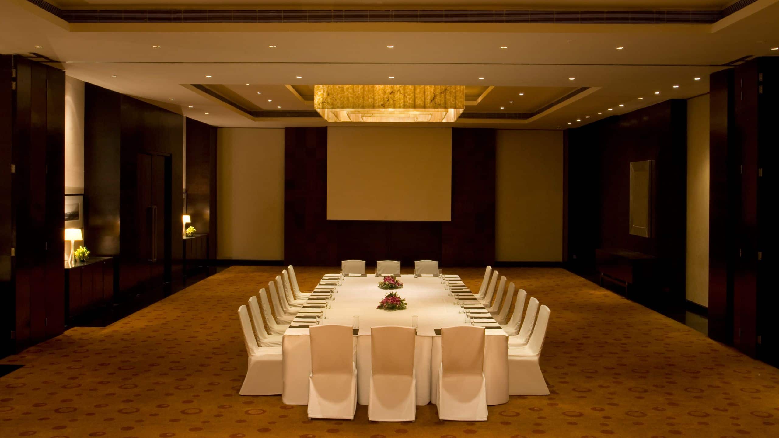 1 of 1 Theatre setup in an indoor banquet hall having warm ambient light for conference