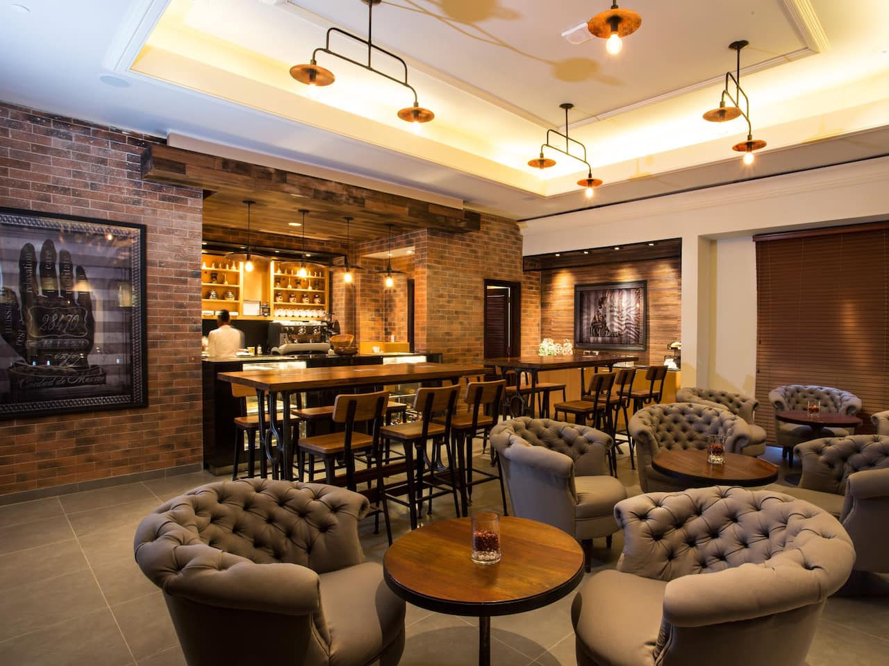 Comfy armchairs and tables at GrindZ Coffee Bar at Hyatt Ziva Rose Hall