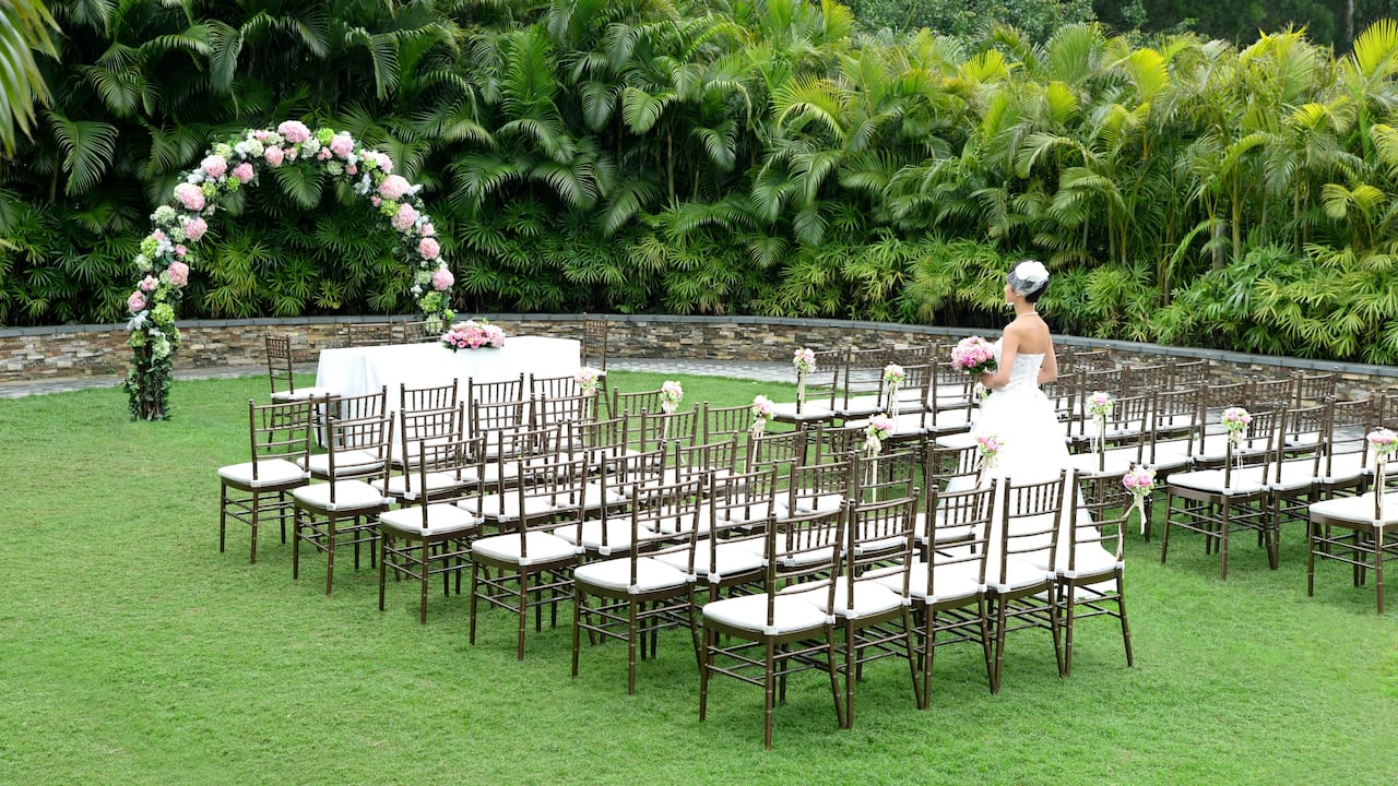 Garden Wedding Ceremony with Bronze Chairs