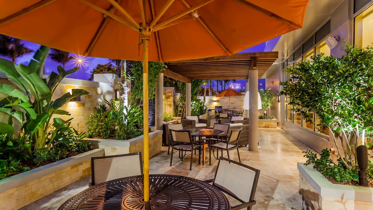 Outdoor patio with tables and umbrellas 