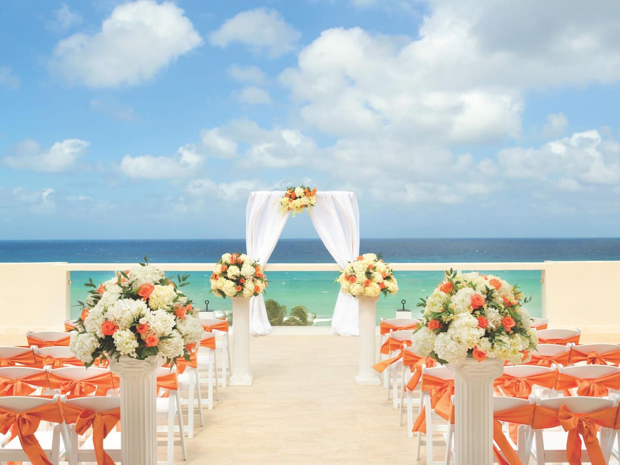 Wedding ceremony setup on resort beachfront