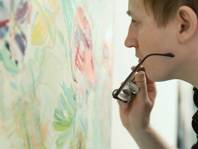 Andaz Salon Man Looking at Painting