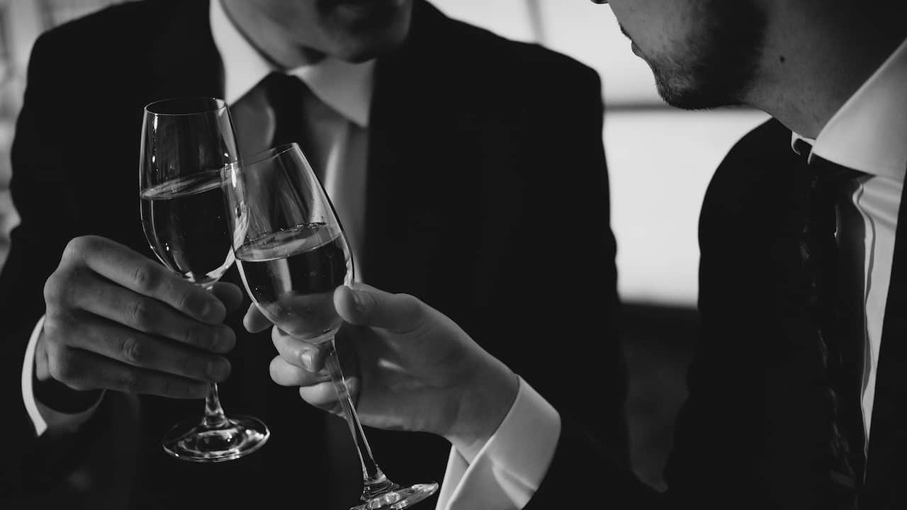 Wedding couple toasting each other