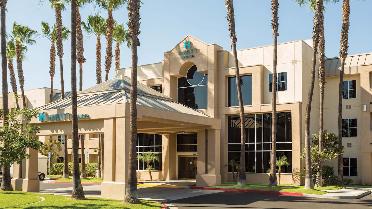 Exterior front entrance with palm trees