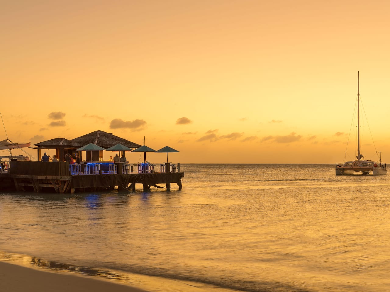 A bar on the pier at sunset in Aruba