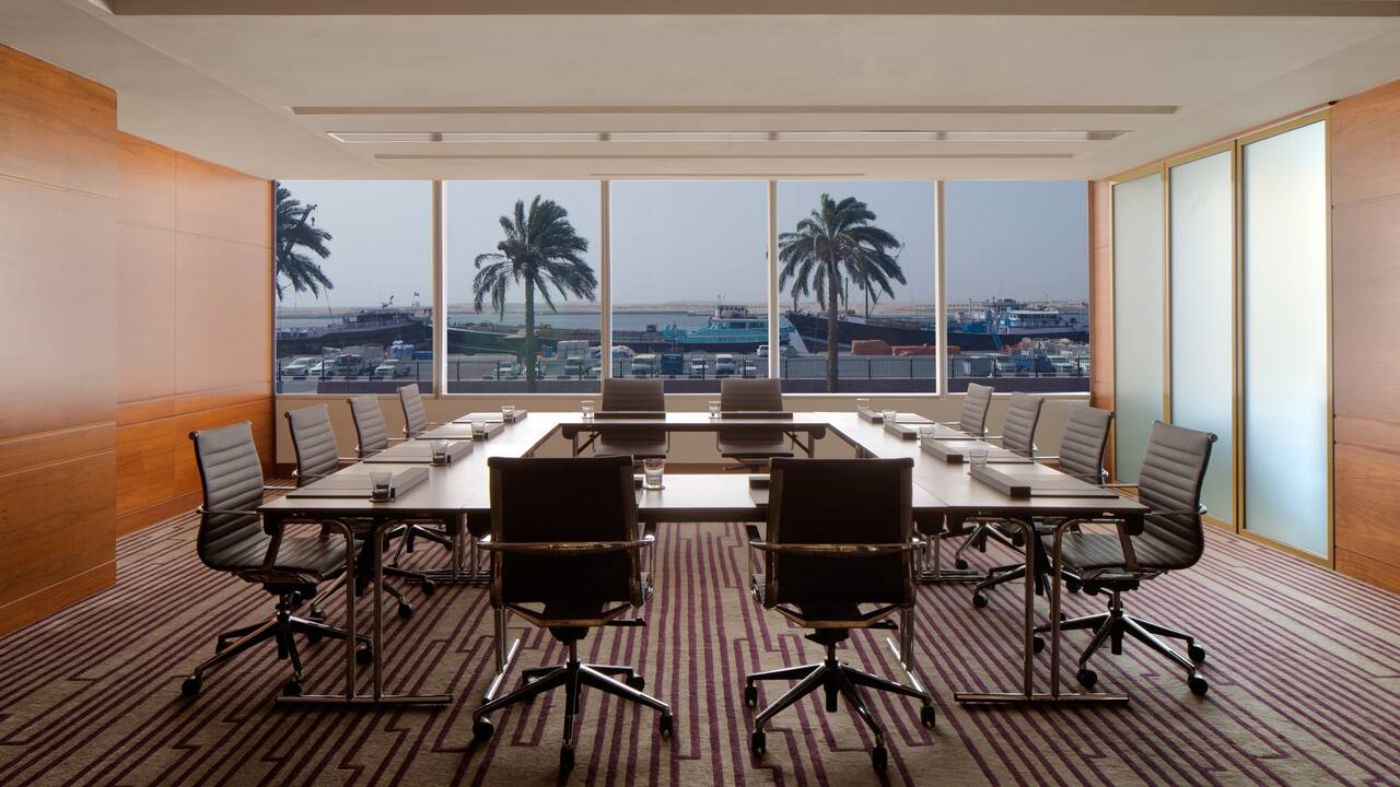Chairs at large table in meeting room