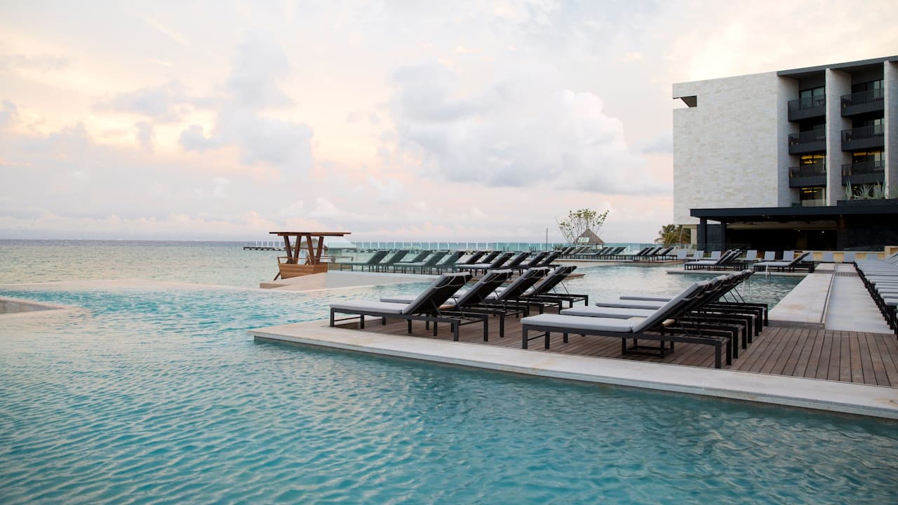 Infinity pool with loungers