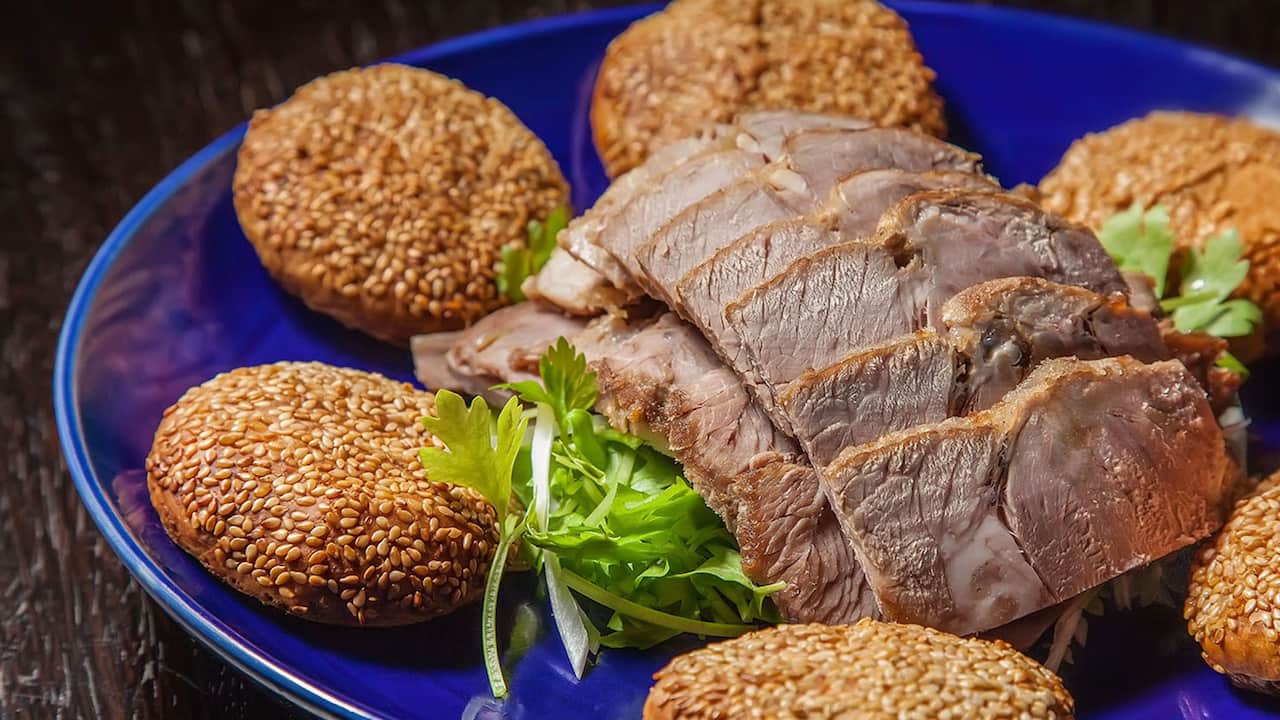 crispy lamb leg and sesame pancakes
