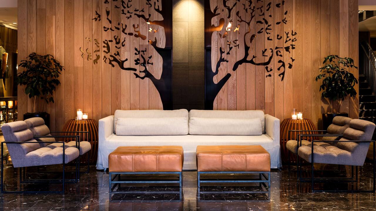 Lobby seating area with tree archway wood paneling