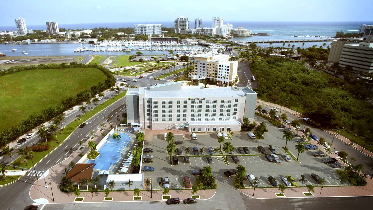 Aerial view of the nearby bay, marina and Hyatt Place San Juan