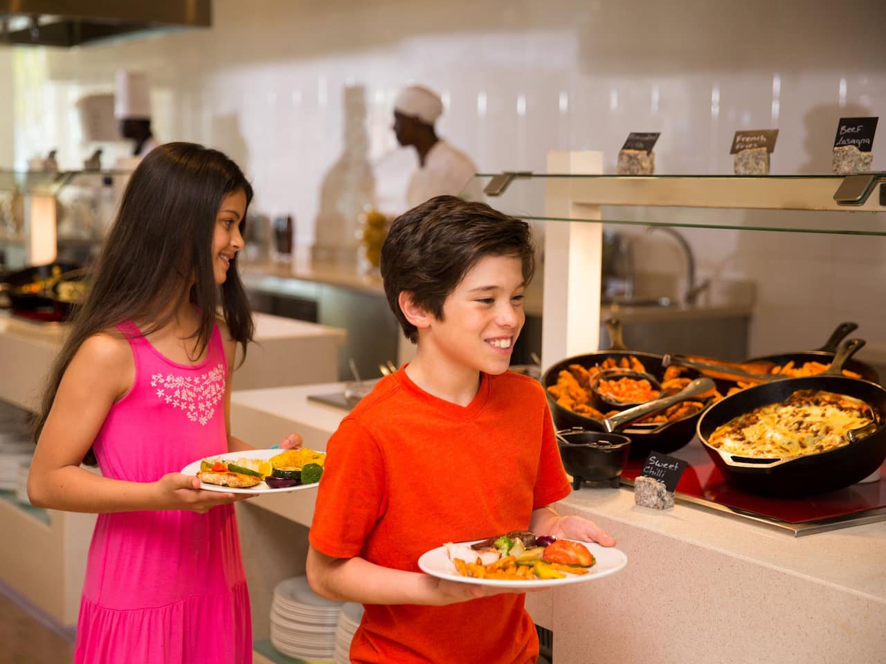 Kids with plates at food buffet at Hyatt Ziva Rose Hall