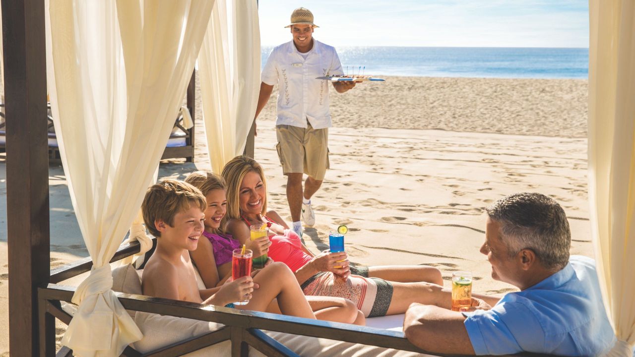 Family Having Drinks in their Beach Cabana