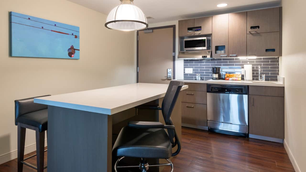 Studio Suite kitchen with dishwasher, microwave, range and large island