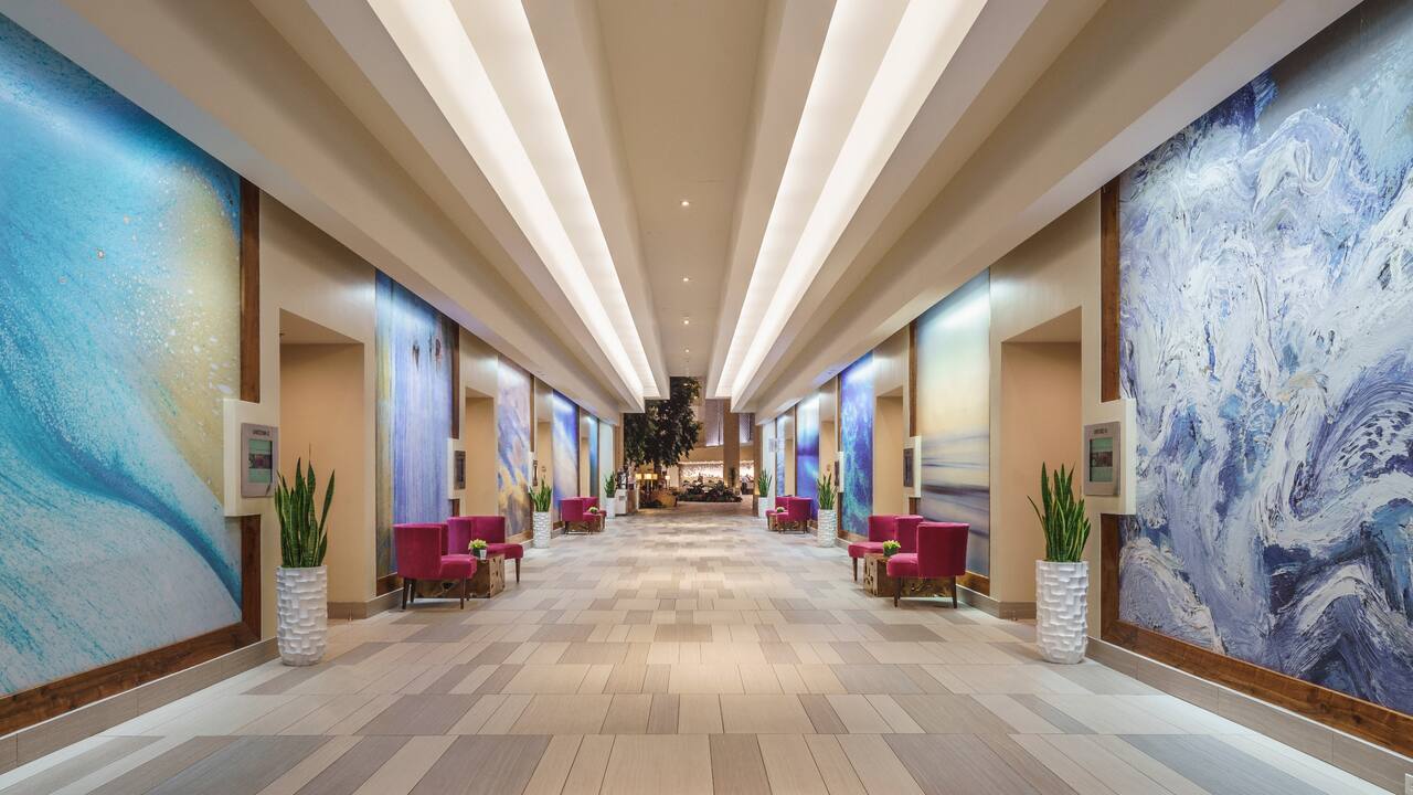 Meeting rooms pre-function hallway area with art on wall