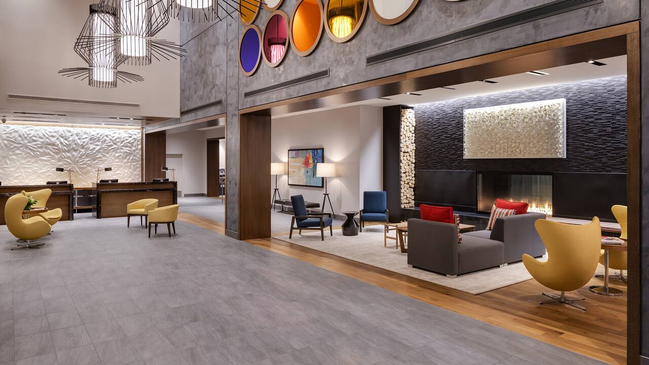 Lobby lounge area with seating and modern fireplace