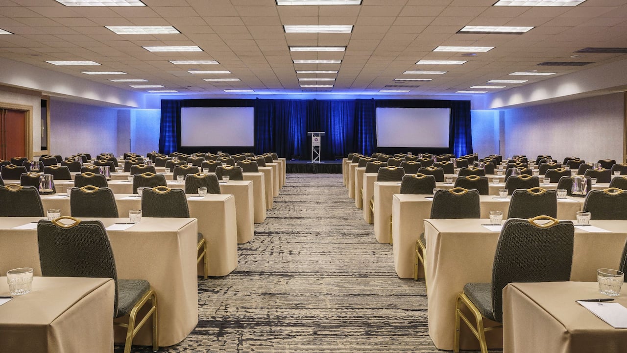 Jasmine Ballroom classroom set-up with stage and projector screens