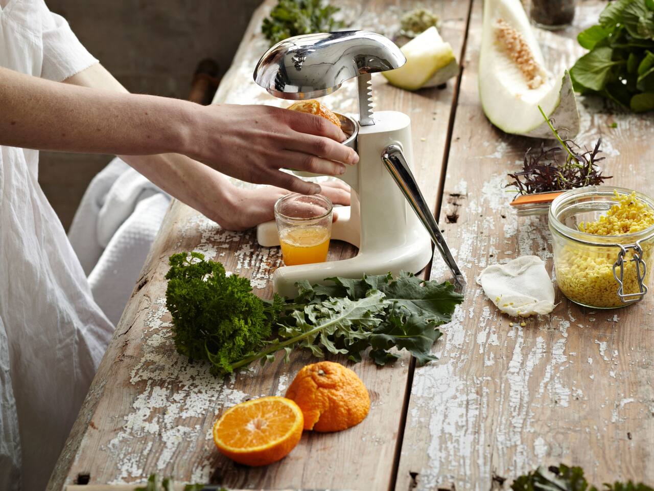 Woman Making Fresh Orange Juice