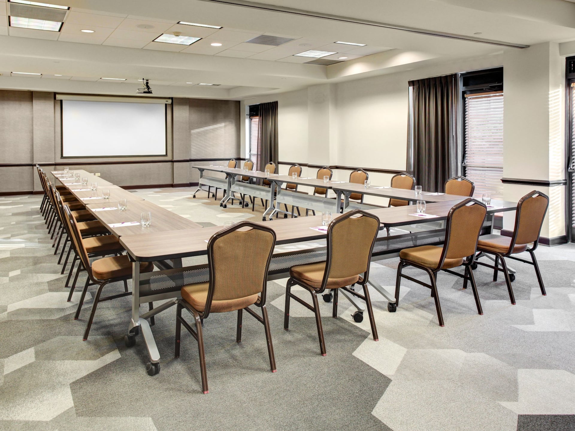 Meeting Room U Shape Table Setup with Projection Screen