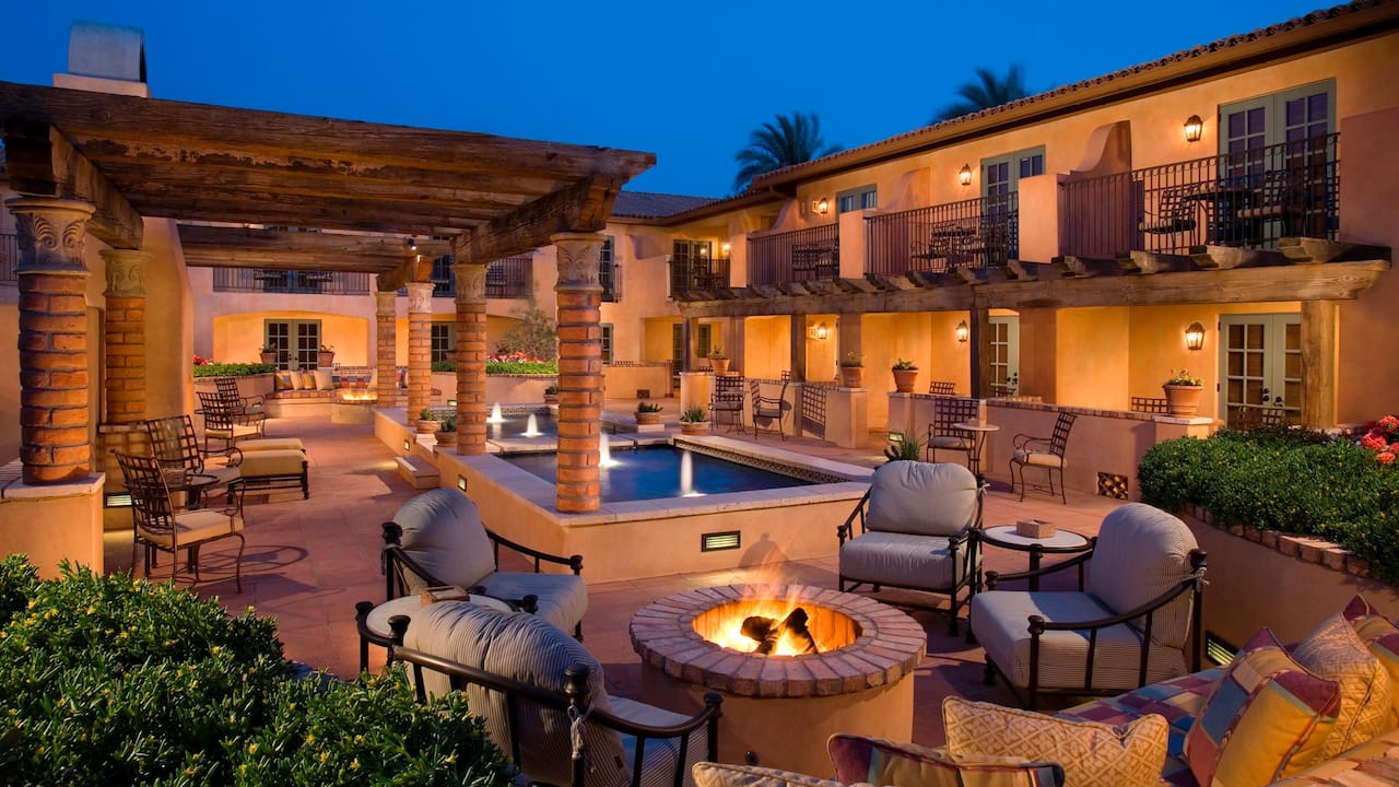 Montavista Courtyard at dusk with lounge seating, firepit, and fountains