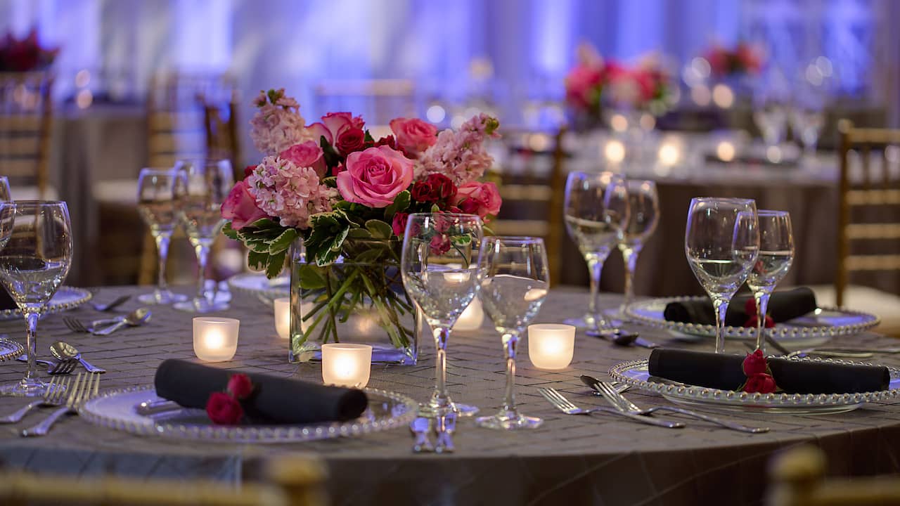 Event space banquet setup with flowers