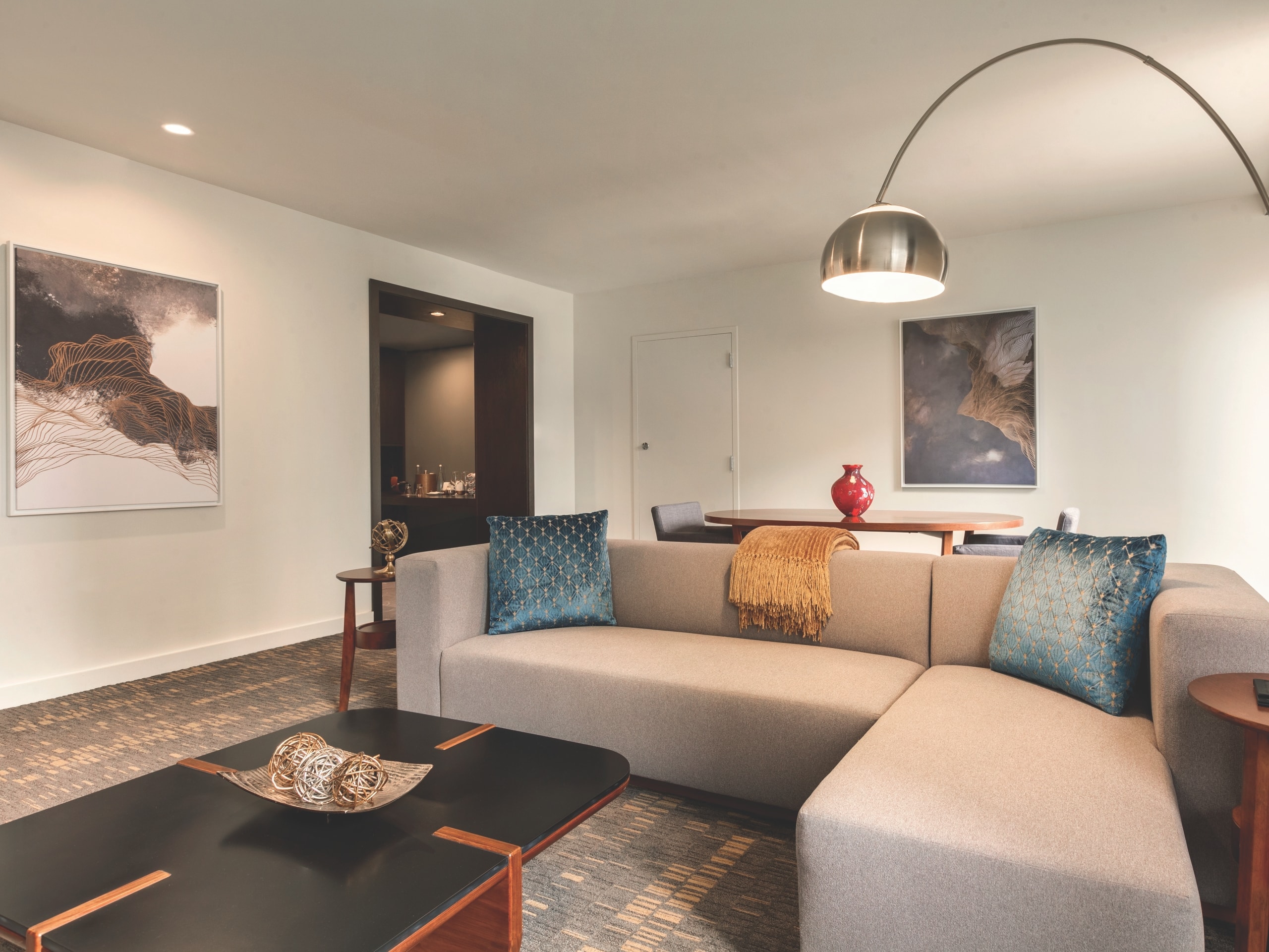 Hyatt Regency Houston grand suite parlor area with couch and modern lamp